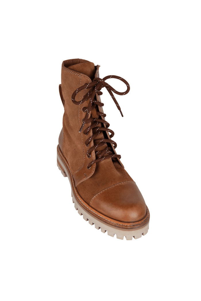 Brown leather boot with laces on a white background