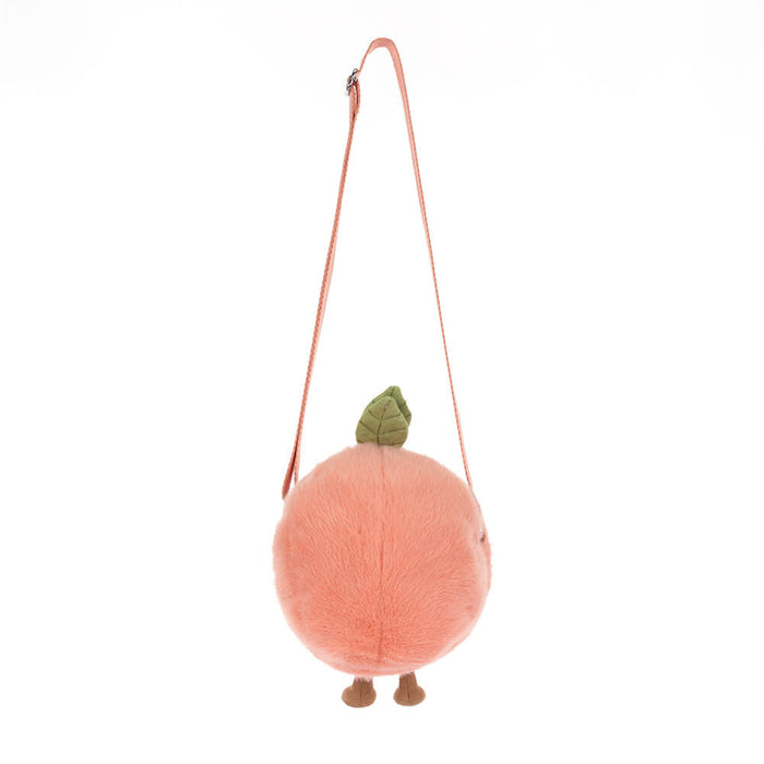 Plush peach-shaped bag with a strap on a white background, viewed from the back