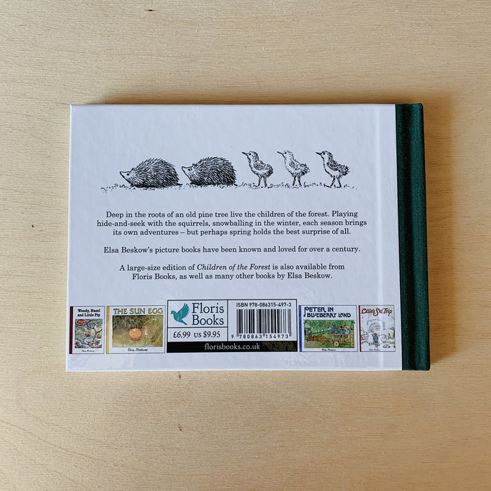 The back cover of the book shown on a wooden surface
