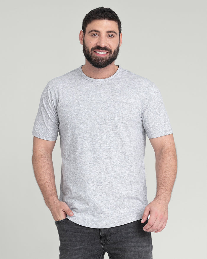 Man wearing heather grey crew neck t-shirt with short sleeves and dark jeans.