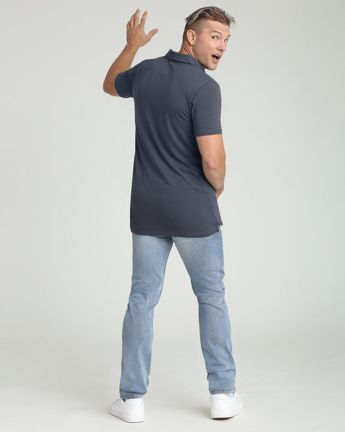 Man wearing steel gray short-sleeve polo shirt with light blue jeans, shown from back view.
