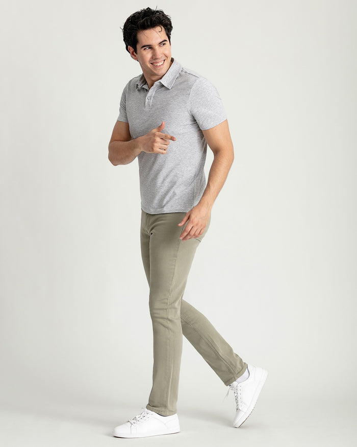 Heather grey short-sleeve polo shirt with collar and button placket on male model.