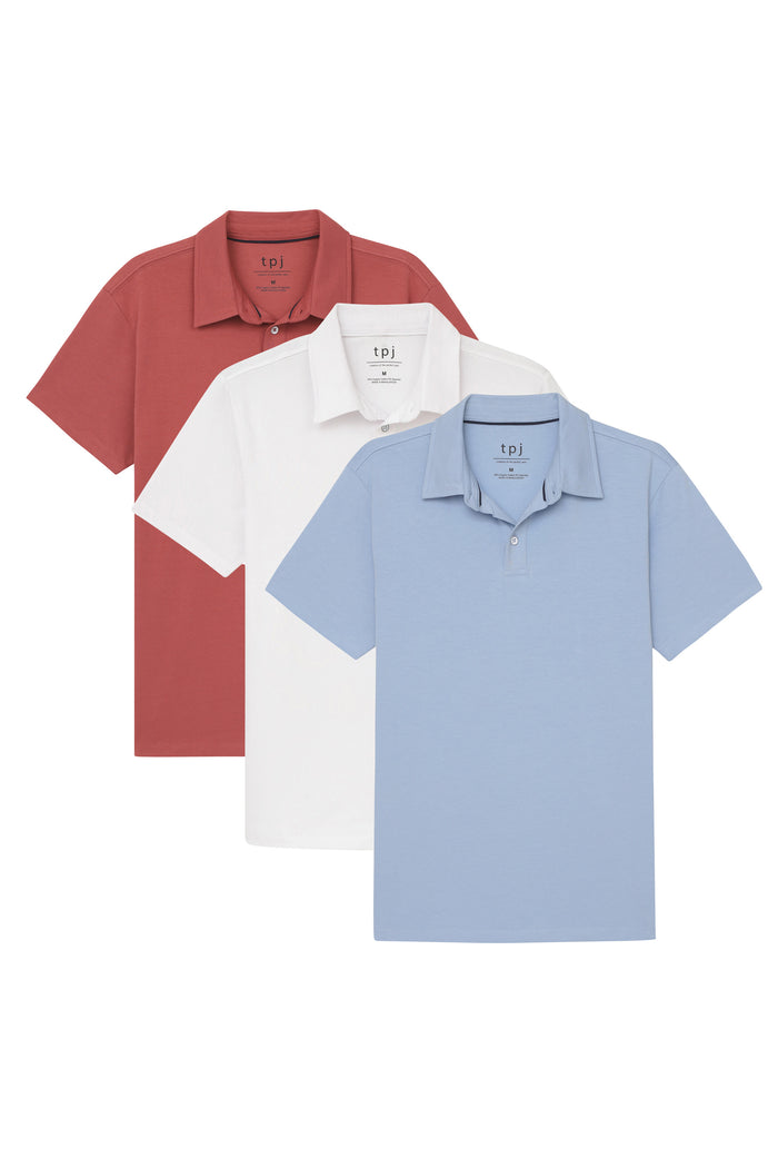 Three short-sleeve polo shirts in red, white, and light blue arranged in an overlapping display.