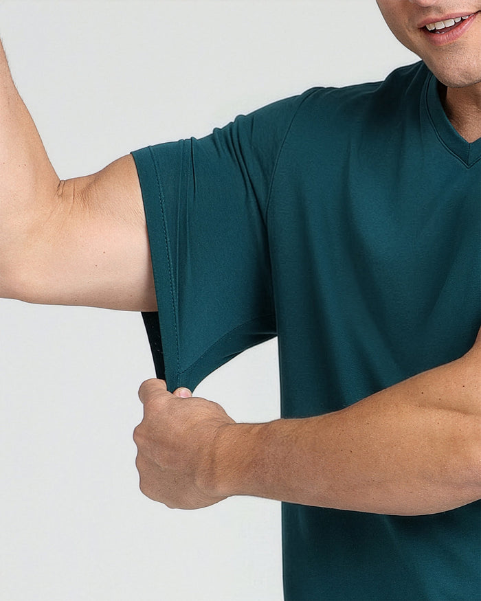 Man wearing teal V-neck t-shirt with short sleeves, showing fabric fit and texture.