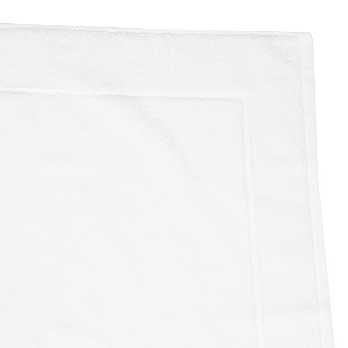 The Sarma Tab Mat uses a dreamy color palette that is woven with simple finished hems for a clean, modern look.