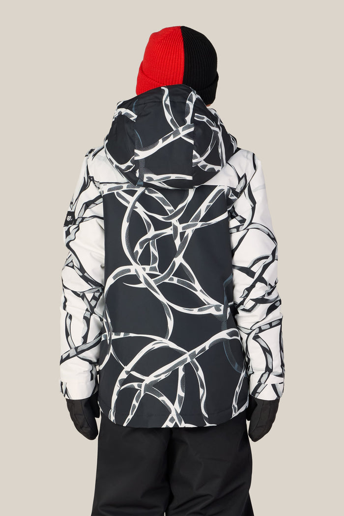 A person is shown from the back against a plain beige background, wearing the 686 Boys’ Gateway™ Insulated Jacket by 686 in a black and white pattern, paired with black pants, black gloves, and a red and black beanie.