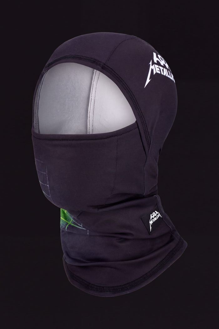 686 Hurra Hinged Balaclava in black, featuring Metallica logos on the forehead and neck with a green graphic on the lower front.