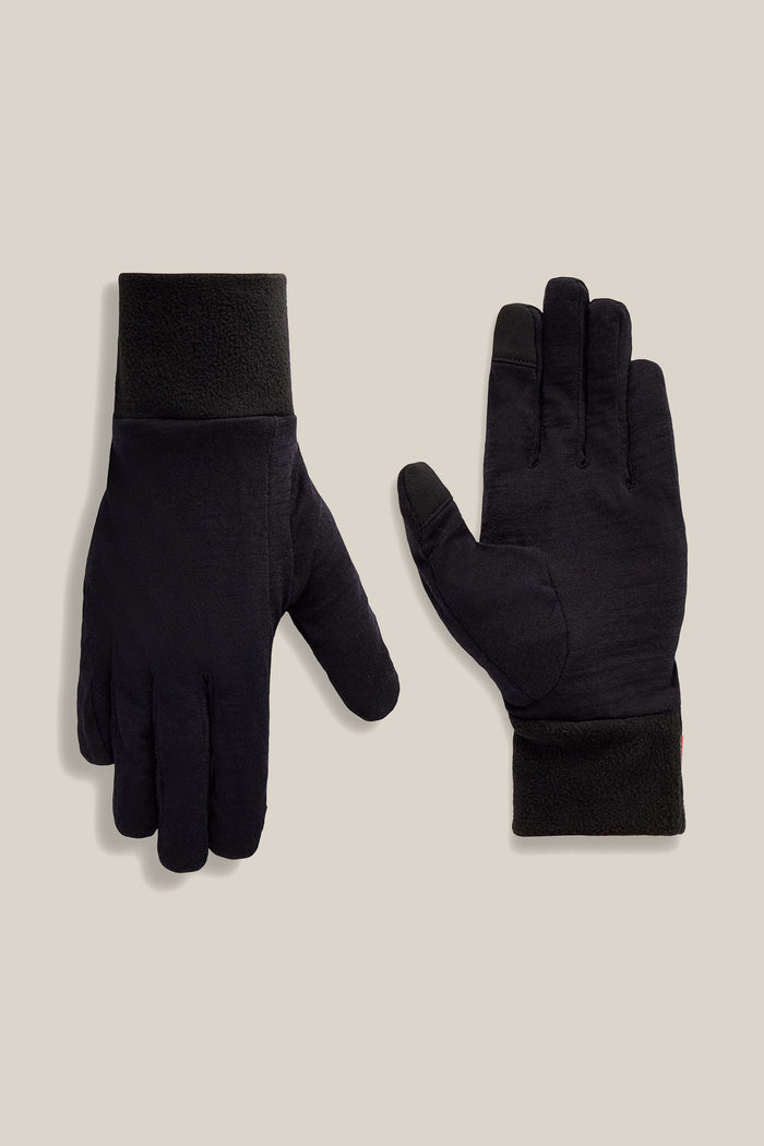 The 686 Women’s GORE-TEX® SMARTY® 3-In-1 Gauntlet Glove is displayed on a beige background, with one glove showing the palm side and the other showing the back.