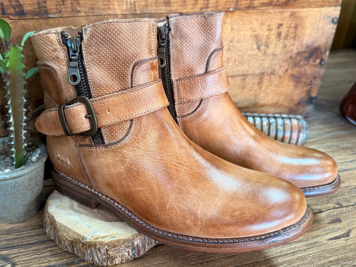 Tan leather ankle boots with strap buckle detail and side zipper