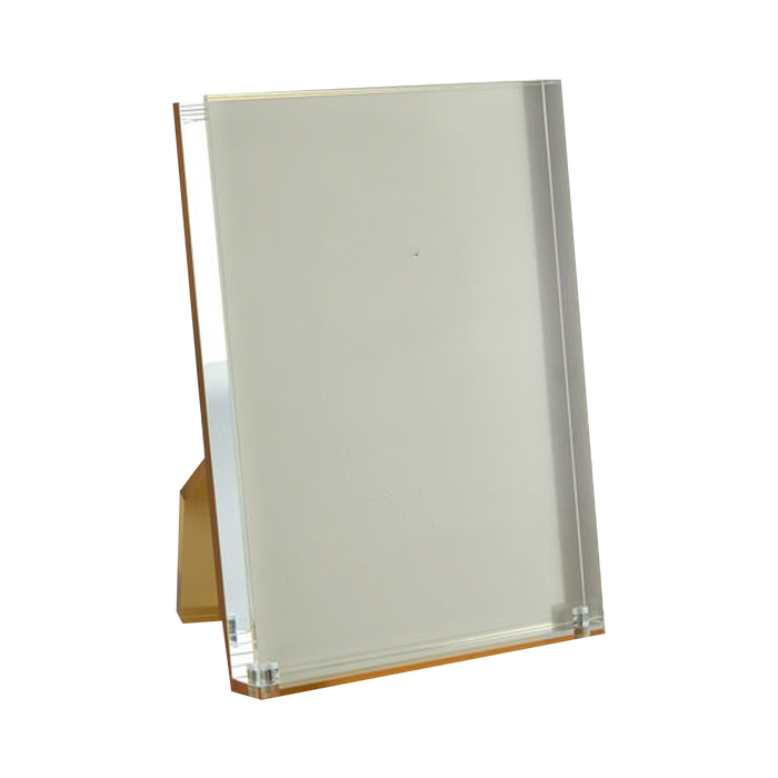 Acrylic picture frame with gold backing that will add stylish flair to any setting.