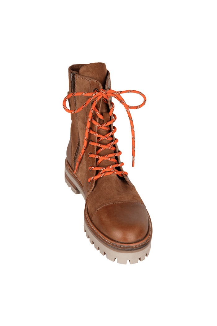 Brown boot with orange laces on a white background