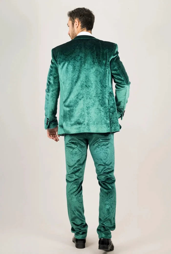 Men's green velvet suit with intricate damask pattern, tailored fit, and matching pants, styled for formal occasions or fashion-forward events.