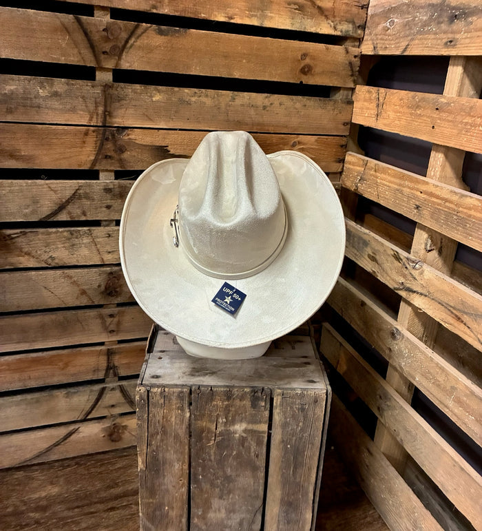 White cowboy hat on a wooden block with a wooden background