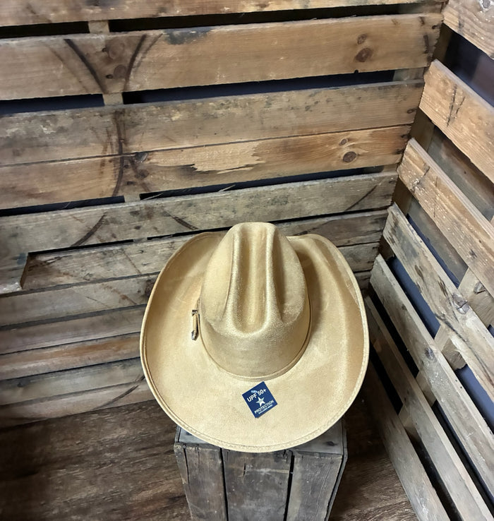 Beige cowboy hat with a brand logo on a wooden surface