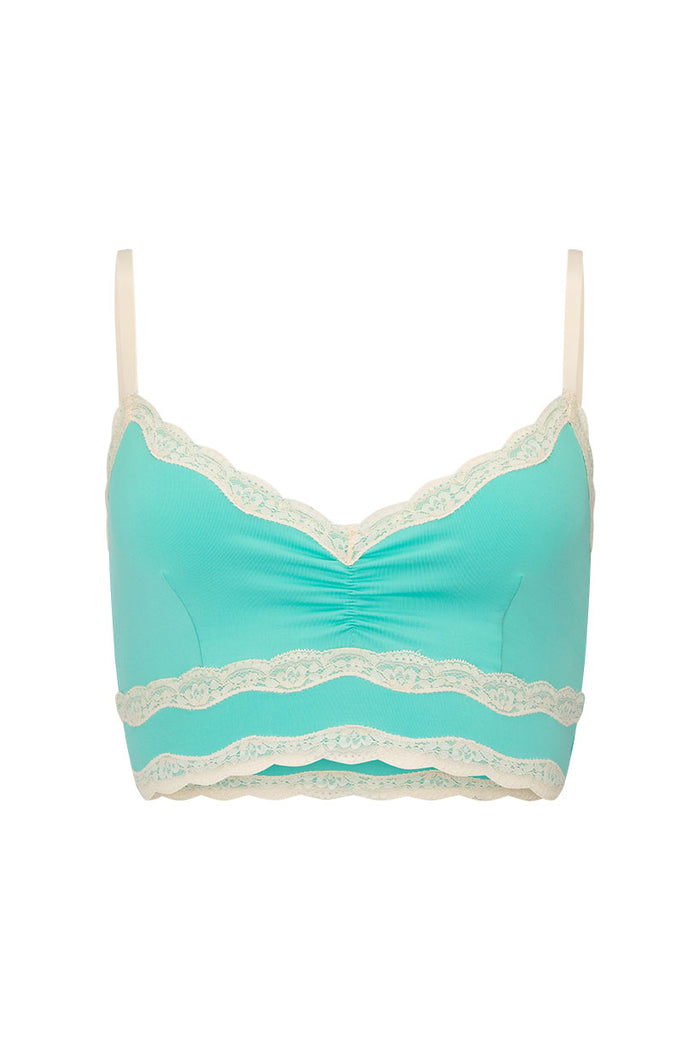 Seafoam bralette flat lay showing cream lace border trim, centre-front ruching, and scalloped hem detail