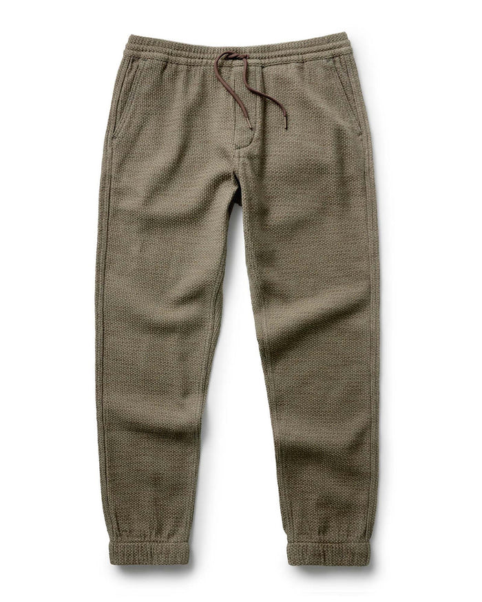 Taylor Stitch Après Ski Pant in Cypress Sashiko, flat lay showing full length olive green sashiko-woven jogger with drawcord waist and elastic cuffs