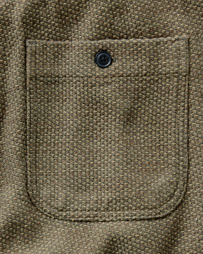 Close-up of the back patch pocket with charcoal button on the Taylor Stitch Après Ski Pant in Cypress Sashiko