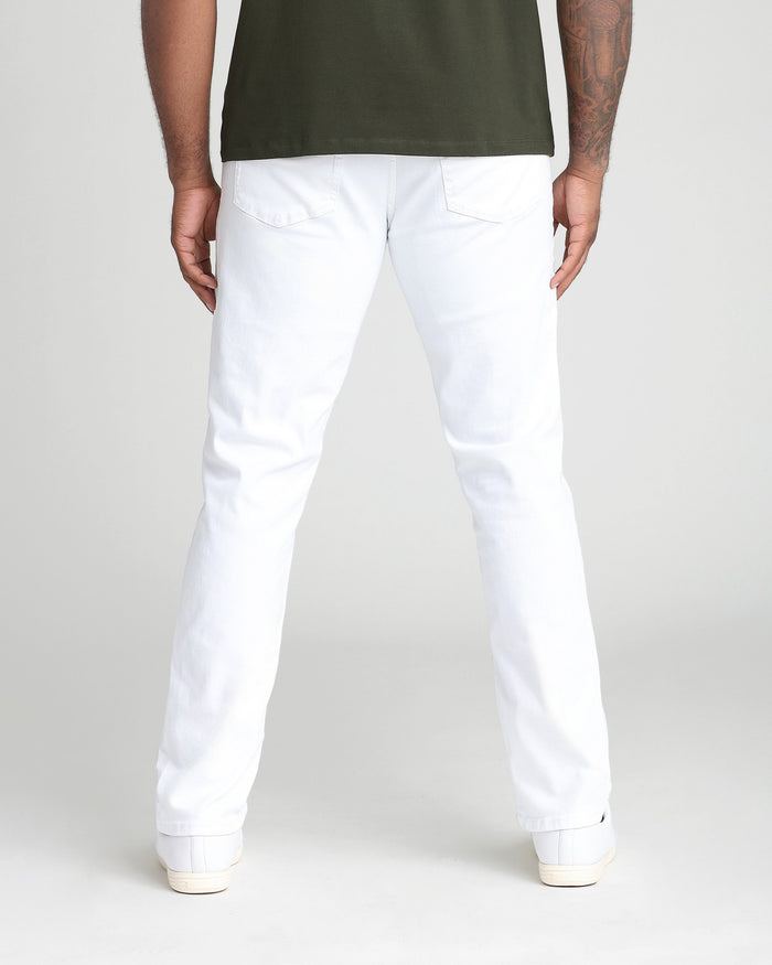 Man wearing white athletic fit jeans with back pockets, shown from behind.