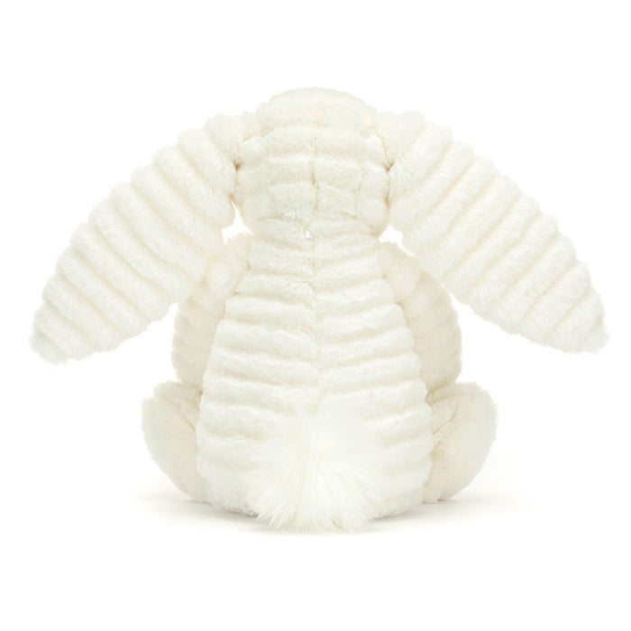 Plush bunny toy with soft ribbed fur pattern, viewed from the back