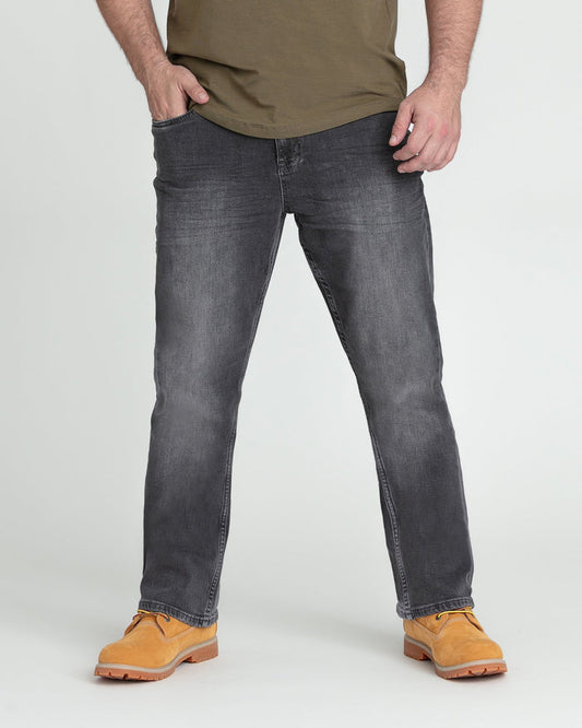 Man wearing grey bootcut jeans with olive shirt and tan work boots.