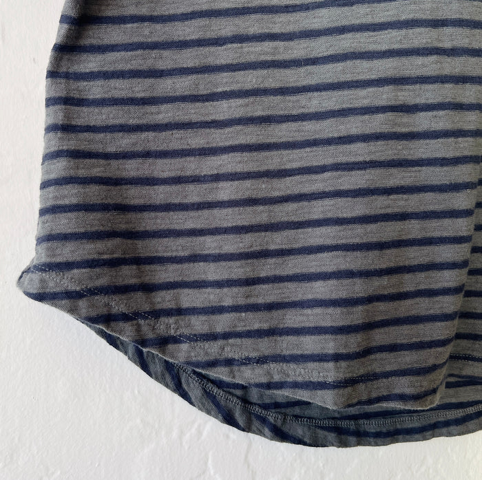 Close-up of a gray and navy striped fabric on a white background