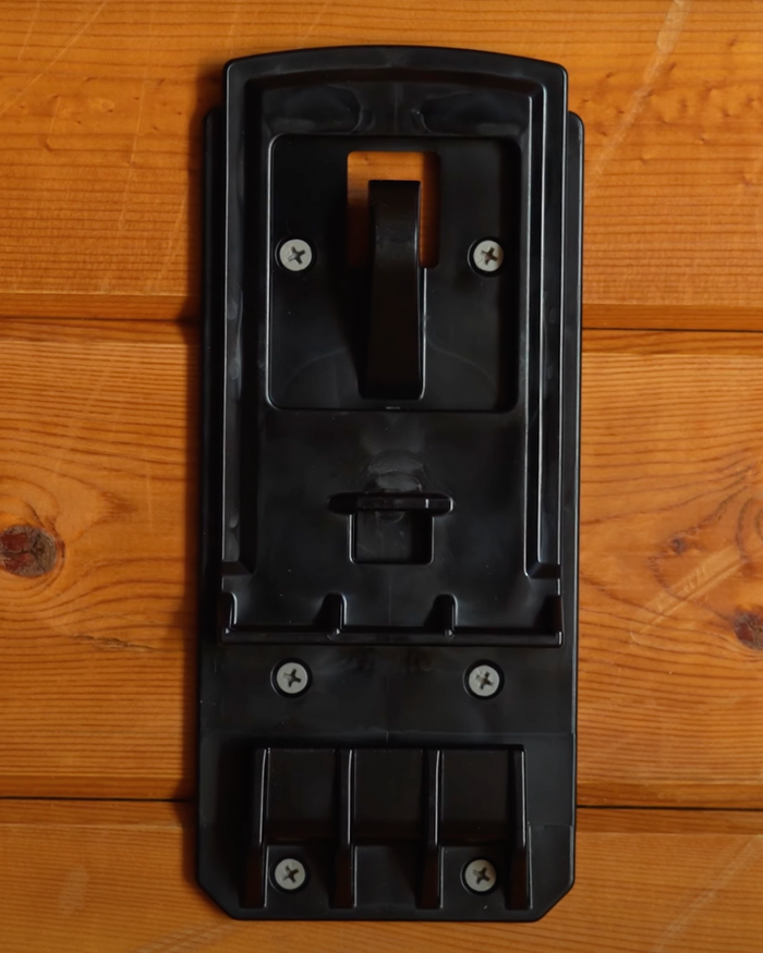 A front-facing view of the Bucket Pro bucket holder, displaying its full design, durable polycarbonate construction, and patented locking mechanism.