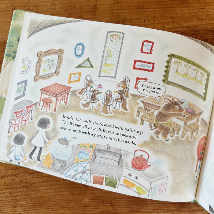 A page of the book with an illustration of a room with animals sitting at tables