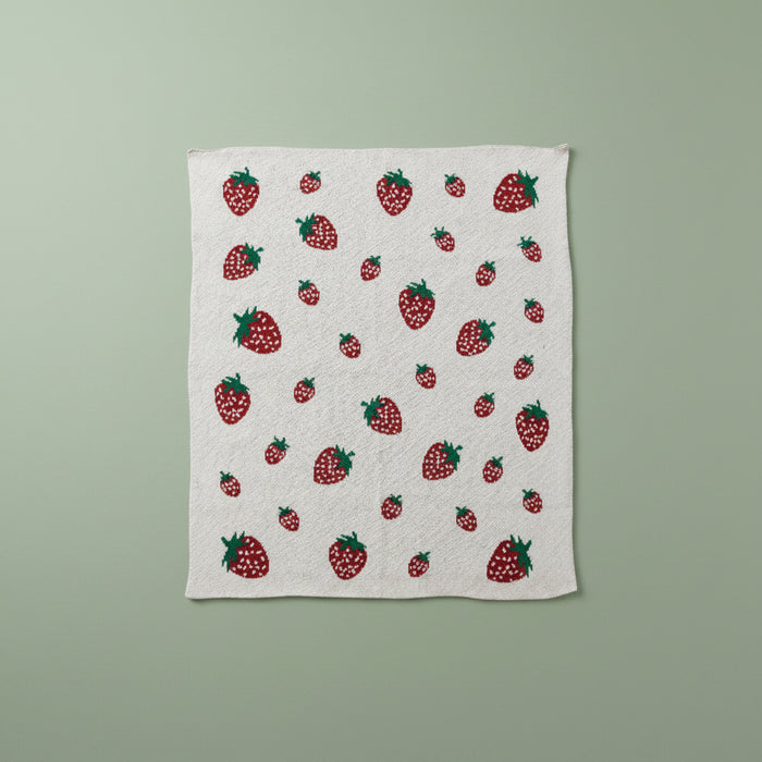 Fabric with strawberry pattern on a green background