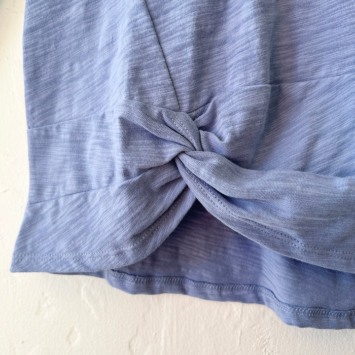 Blue fabric with a knot on a white background
