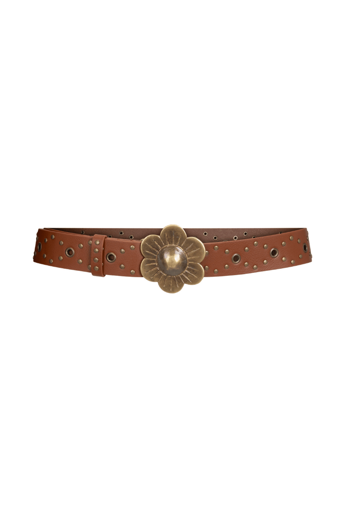 Tan leather belt with antique brass daisy buckle, stud detailing, and brass eyelets on white background