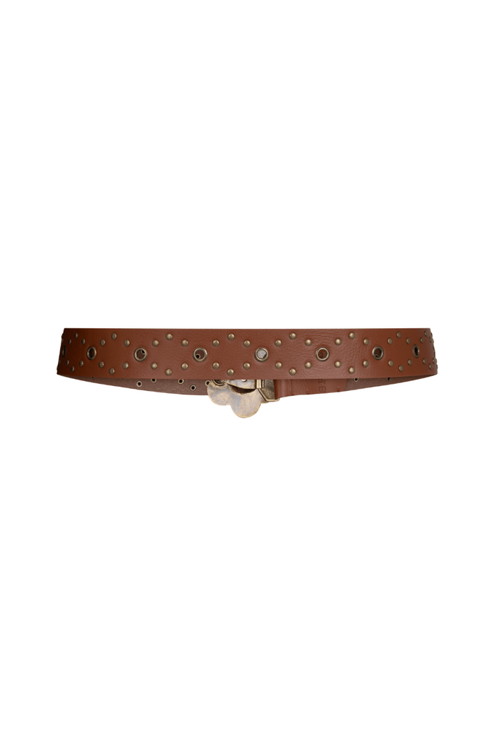 Tan leather belt laid flat showing antique brass daisy buckle, stud detail, and brass eyelets on white background