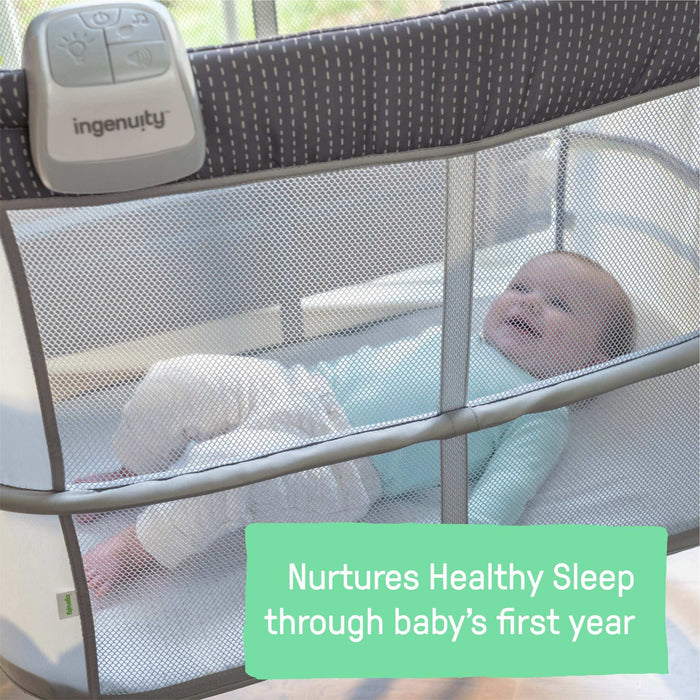 Dream and Grow Bedside Bassinet with breathable mesh sides and adjustable height for newborns to 12 months