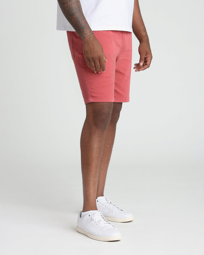 Nantucket red athletic fit shorts on model wearing white t-shirt and white sneakers.