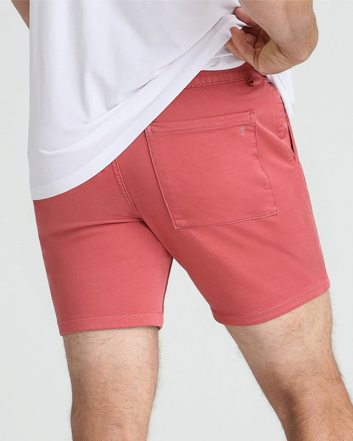 Nantucket red slim-fit shorts with back pocket, paired with white t-shirt.