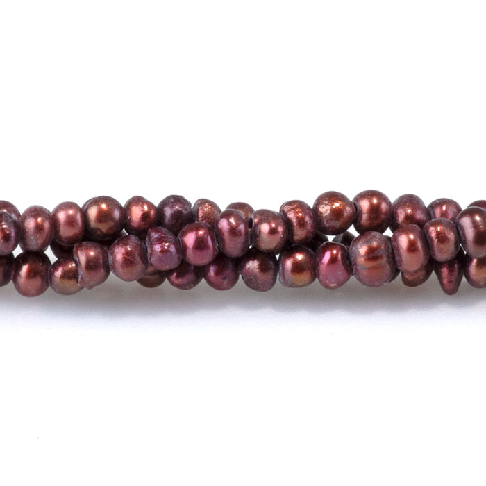 This is a Dakota Stones 2-5mm Freshwater Pearl Burgundy Potato Gemstone strand of round beads in 15-16 inch strand.