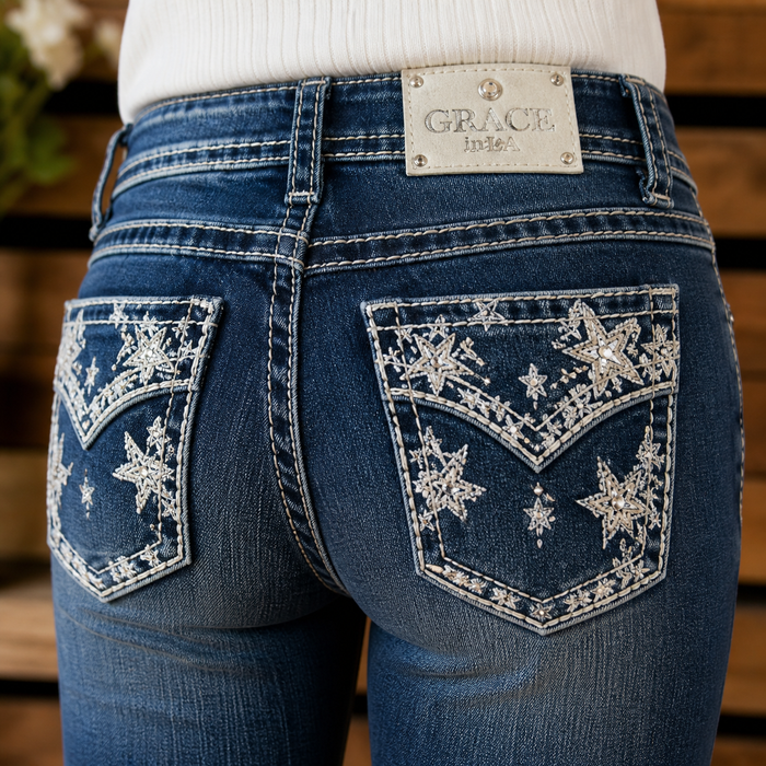 Blue jeans with decorative star patterns on the back pockets, brand 'Grace' visible.