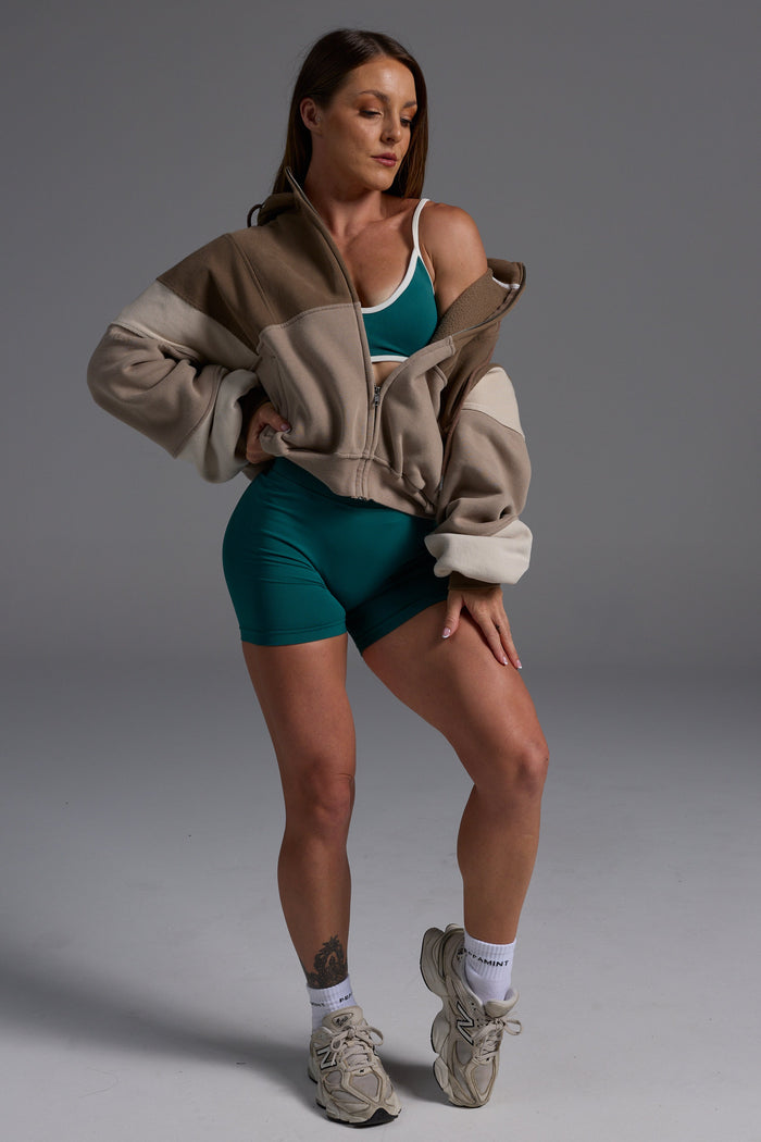 Hip length, full zip hoodie, with ribbed panels, embossed sleeve logo, in a slouchy oversize fit, with 2 convenient zip pockets, in mocha, stone and beige