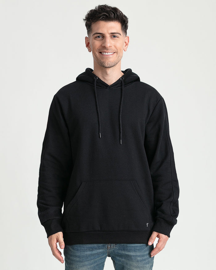 Black hoodie with drawstring, kangaroo pocket, and ribbed cuffs, worn with blue jeans.