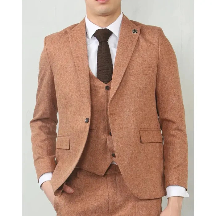 Men's camel tailored fit wedding 3-piece suit with textured fabric, notch lapel blazer, matching vest, and dress pants, styled for formal occasions.