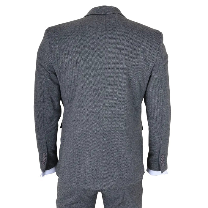 Back view of men's grey tweed herringbone suit with tailored fit, showing the structured shoulders and matching trousers in a formal style.