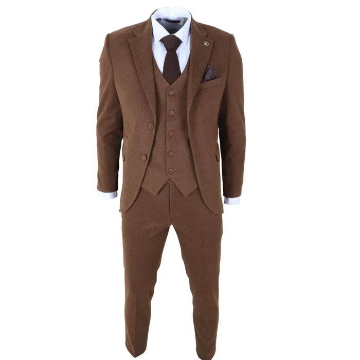Close-up of men's brown tweed suit jacket with notch lapel, matching waistcoat, and trousers, styled with white shirt and dark tie