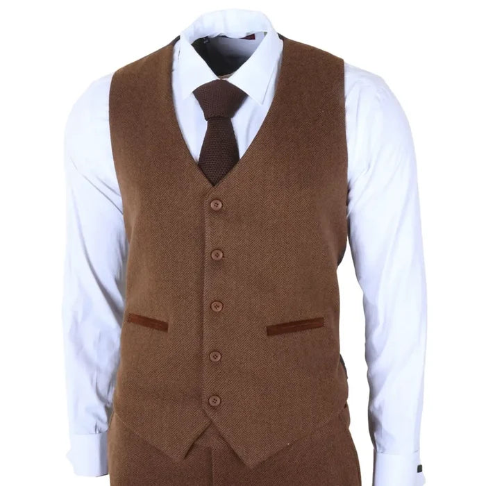 Men's brown 3 piece tweed suit with a textured herringbone pattern, includes jacket, vest, and trousers, paired with a white shirt and brown tie