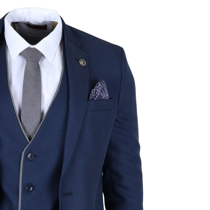 Navy blue men's 3 piece tailored fit suit with textured fabric, white dress shirt, gray tie, and patterned pocket square, ideal for formal occasions.