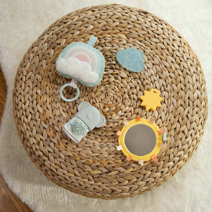 Calm Springs Soothing Essentials Gift Set with musical plush toy, teething mitt, sun mirror, and teethers for newborn sensory comfort