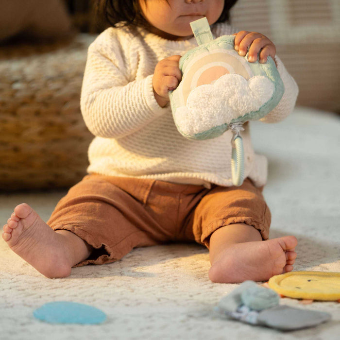 Ingenuity Calm Springs Soothing Essentials Gift Set with musical plush toy, teething mitt, sun mirror, and teethers for newborns