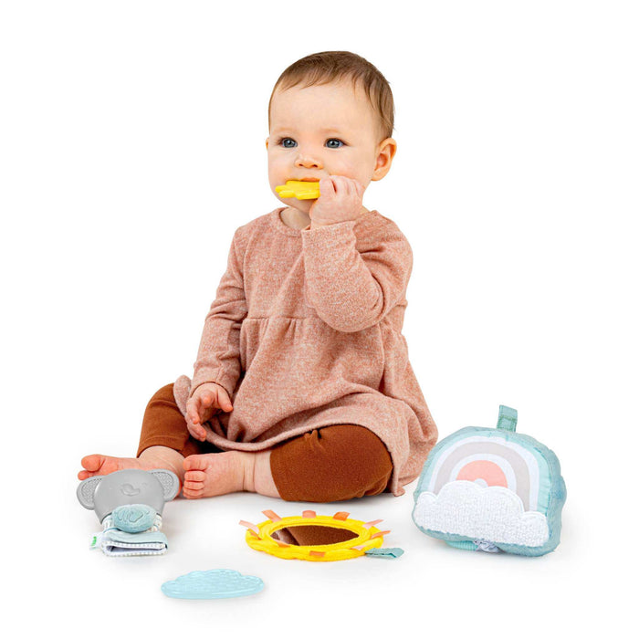 Ingenuity Calm Springs Soothing Essentials Gift Set with musical plush toy, teething mitt, sun mirror, and teethers for newborns.