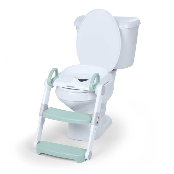 Ingenuity Foldaway Ladder Potty adjustable height toilet trainer with handles folded flat for compact storage on bathroom floor