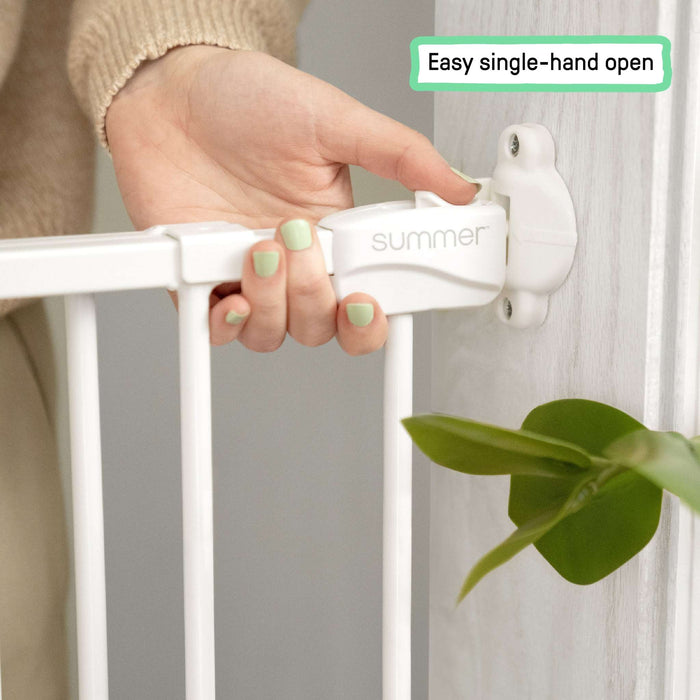 Summer by Ingenuity white metal Stairway 42W Series safety gate installed at top of stairs.