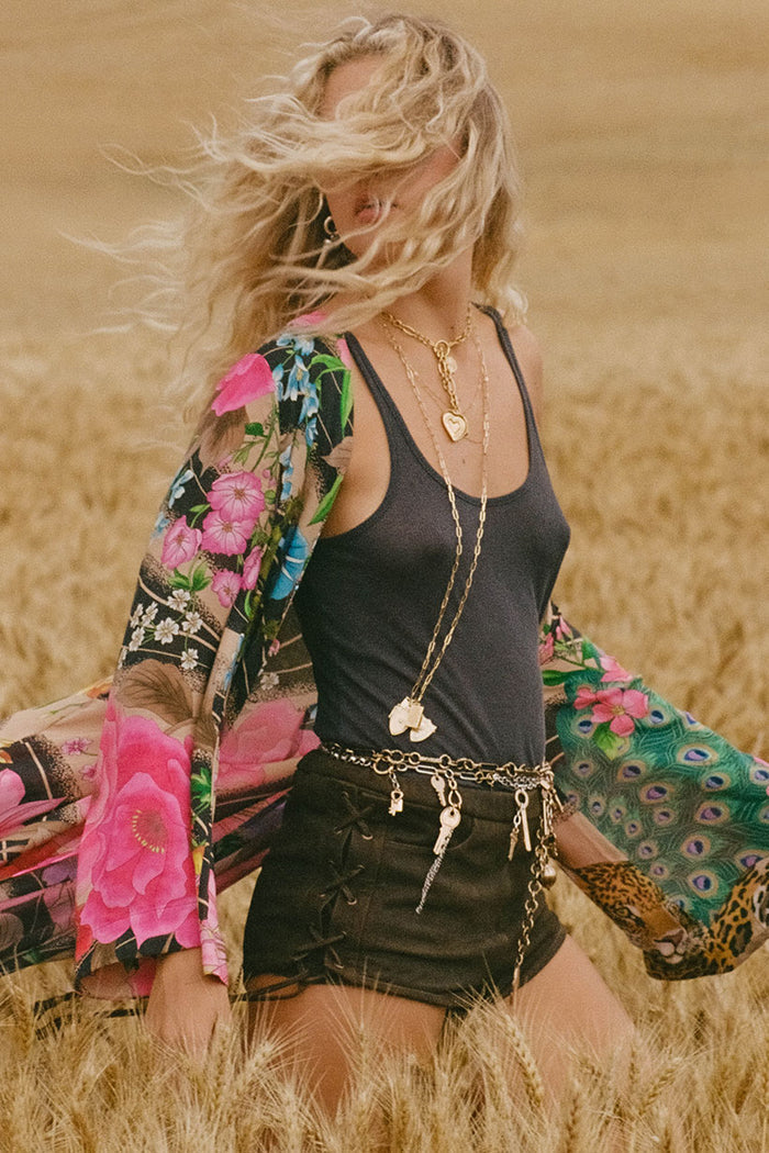 Side view of model in charcoal TENCEL hemp rib singlet, styled with floral kimono in wheat field