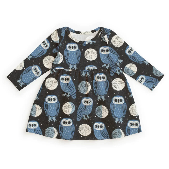 Children's dress with blue owl pattern on a white background